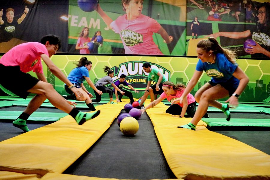 Teens playing trampoline dodgeball at Launch Trampoline Park
